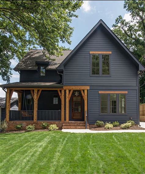 dark blue house cedar post dark metal roof|dark blue house exterior colors.